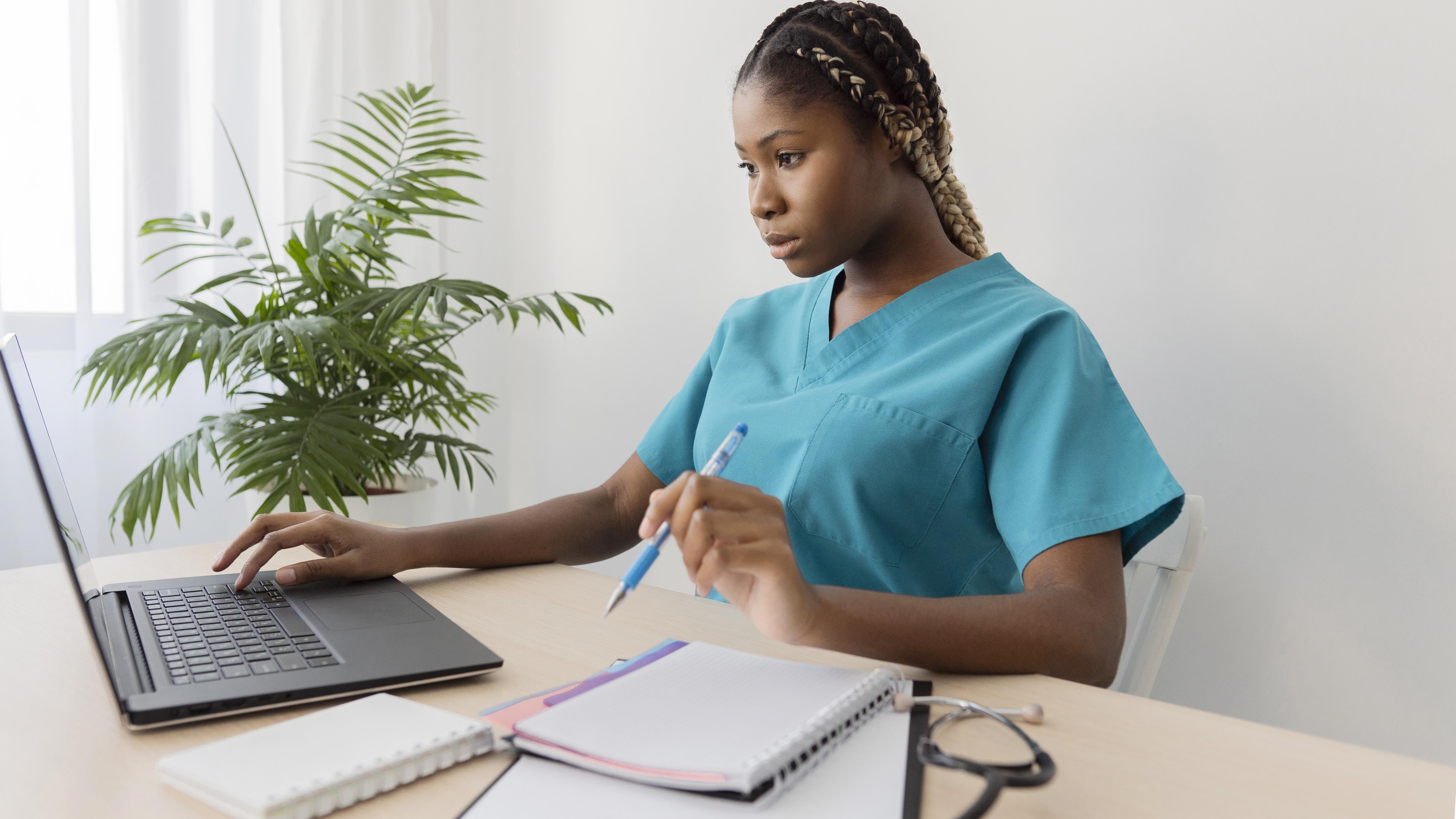 Healthcare student using a tablet for lesson review and objective question practice